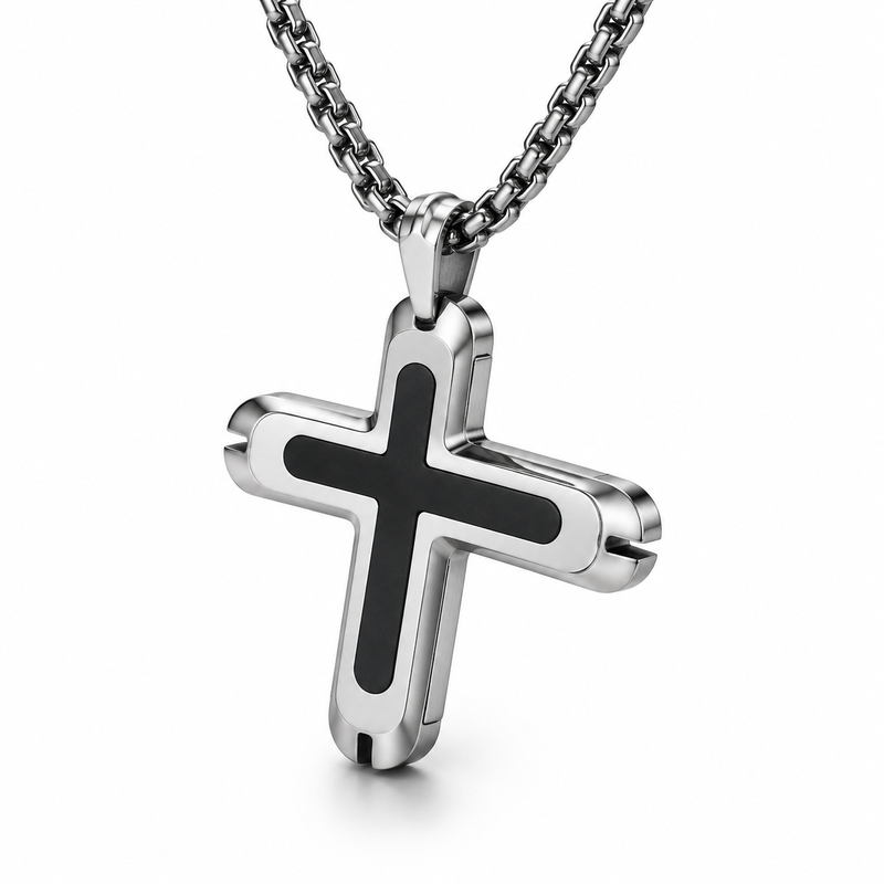 Angled studio close-up of men's bullet-notched rounded cross pendant on white reflective surface
