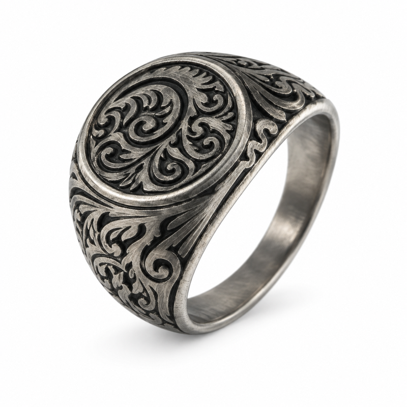 Detailed view of intricate filigree engraving on stainless steel signet ring
