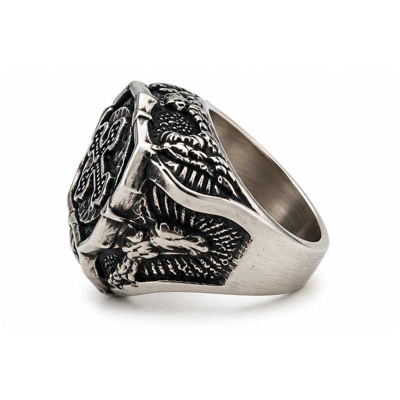 Side profile showing winged heraldic eagle carvings on cross signet ring

