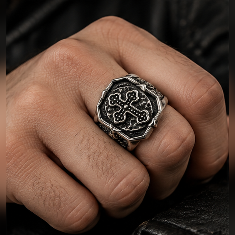 Model wearing vintage stainless steel cross statement ring on hand

