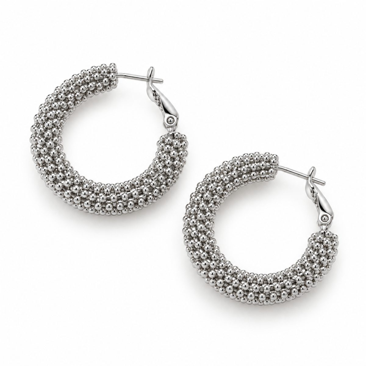 Studio overhead shot of silver beaded mesh texture latch-back hoop earrings
