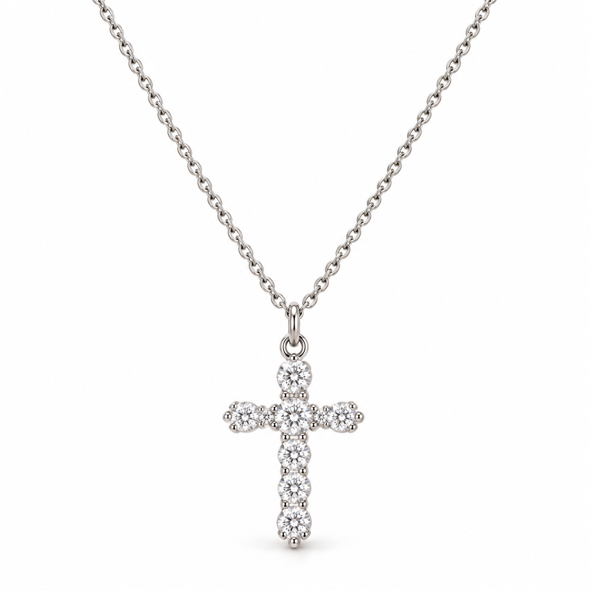 Dainty silver-tone stainless steel cable chain necklace featuring round-cut cubic zirconia crucifix pendant
