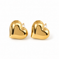 Pair of chunky puffy gold heart stud earrings in high-polished stainless steel on a white background
