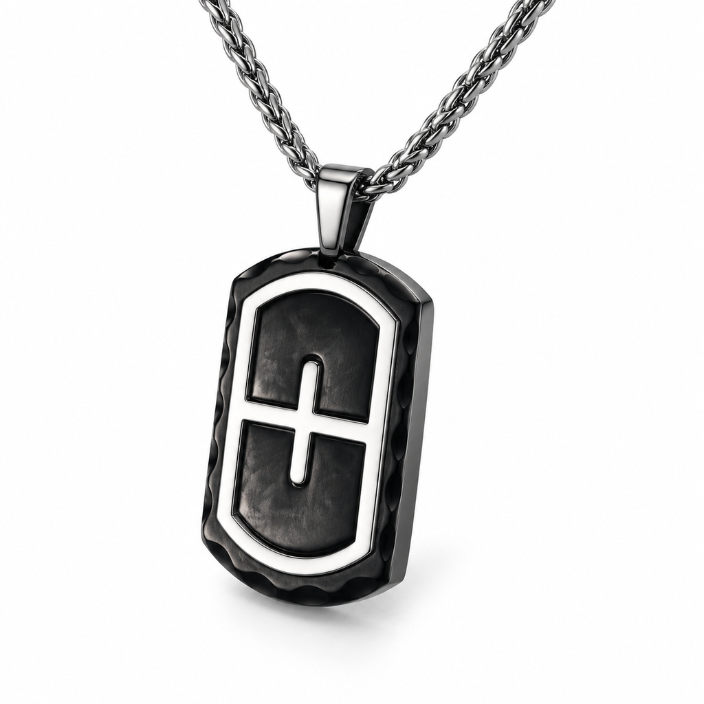 Angled studio close-up of men's chiseled black scalloped rim cross dog tag pendant
