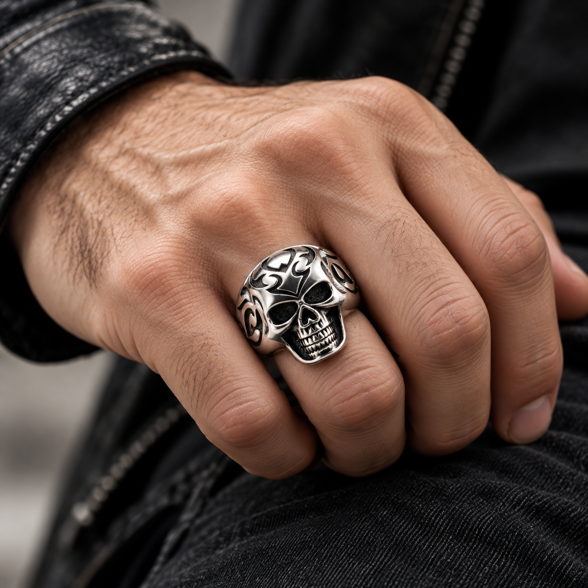 Model wearing tribal flame skull statement ring on hand
