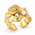 18K gold plated organic molten wide band ring with dangling coin, teardrop crystal, and pearl charms on white background
