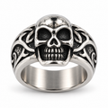 Vintage stainless steel skull ring with intricate carved gothic details
