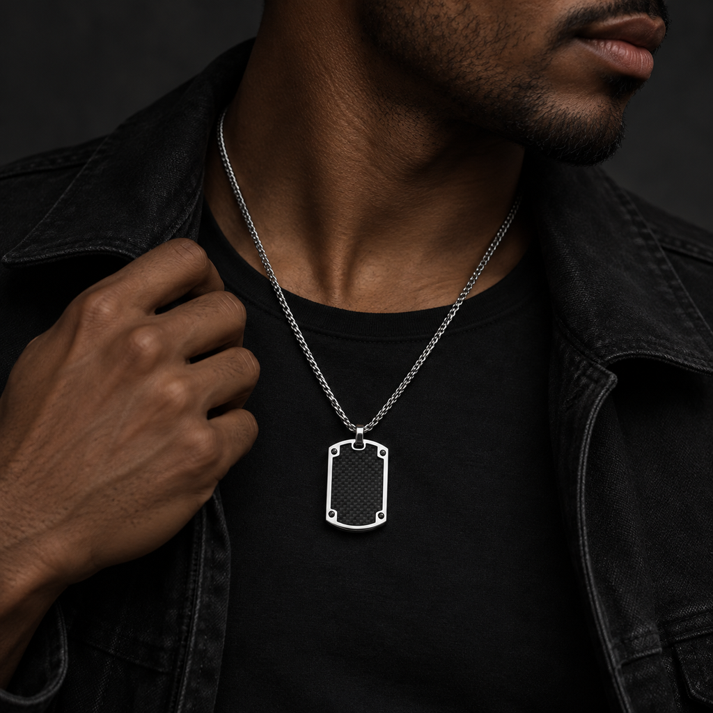 Front studio shot of men's bolted carbon fiber dog tag necklace on braided wheat chain
