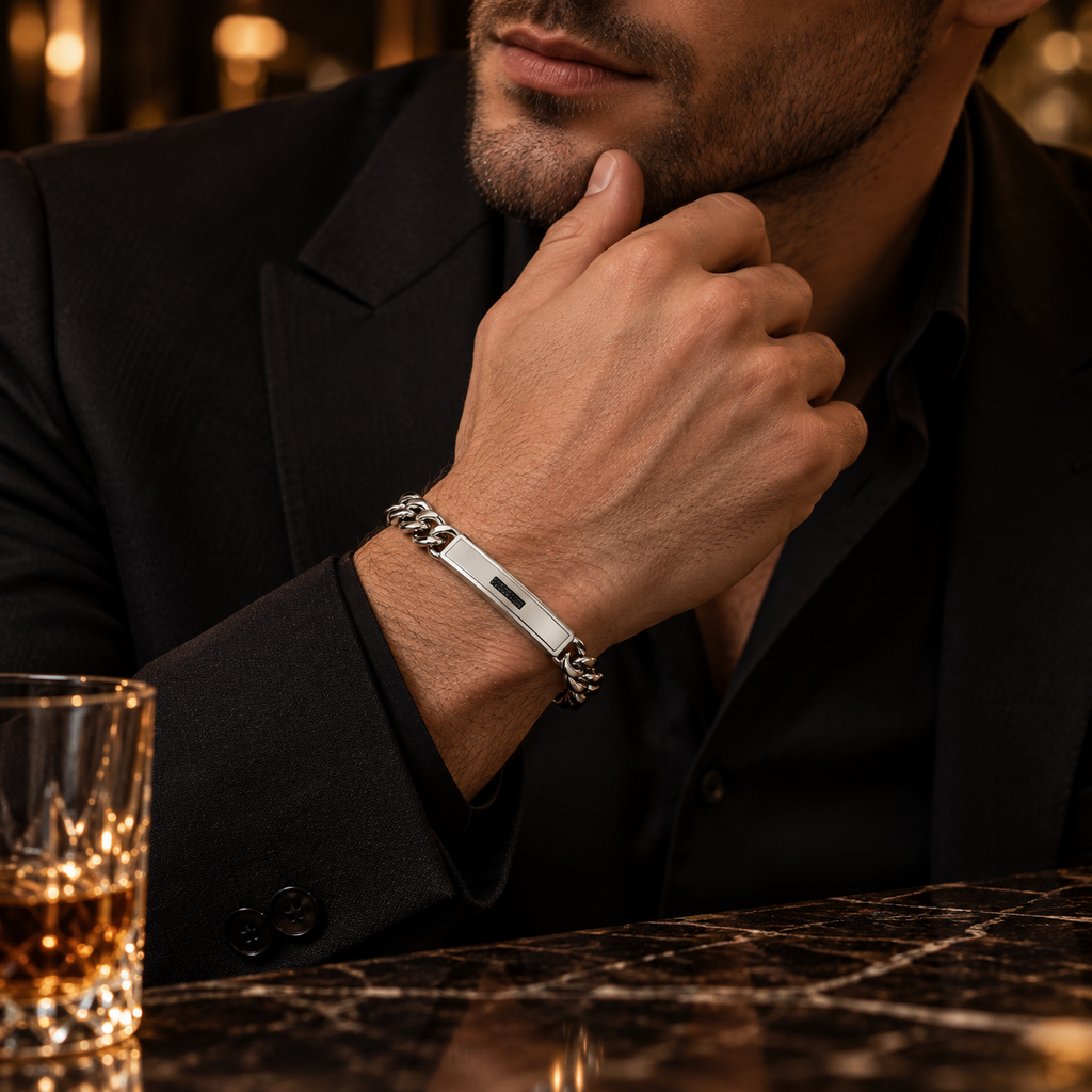 Model wearing men's steel black pavé CZ ID bar bracelet with black tailored suit
