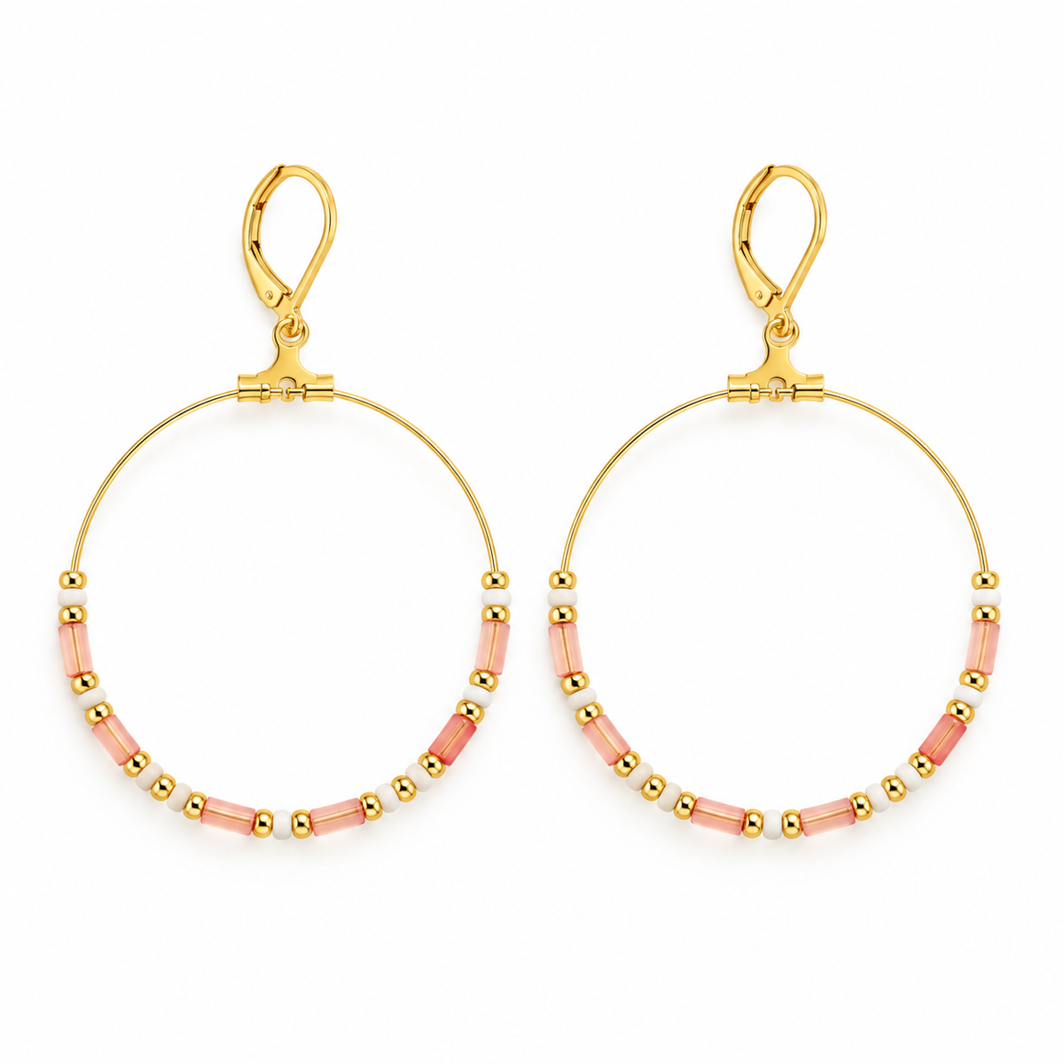 Pair of women's boho large gold hoop earrings with pastel pink tube beads and leverback clasps on white background
