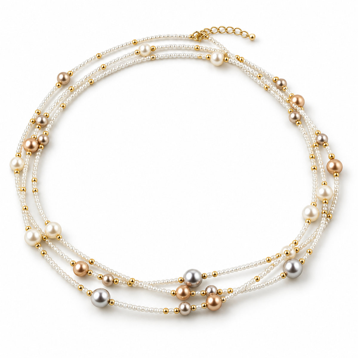 Women's multi-strand layered bracelet with white seed beads and assorted champagne, silver, and white pearls on white background
