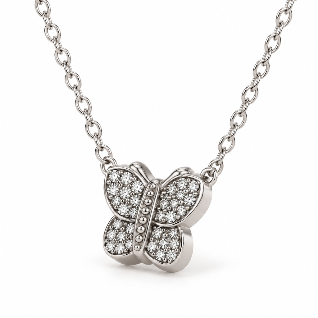 Close-up macro detail of 3D silver butterfly charm featuring brilliant pavé-set round cubic zirconia stones
