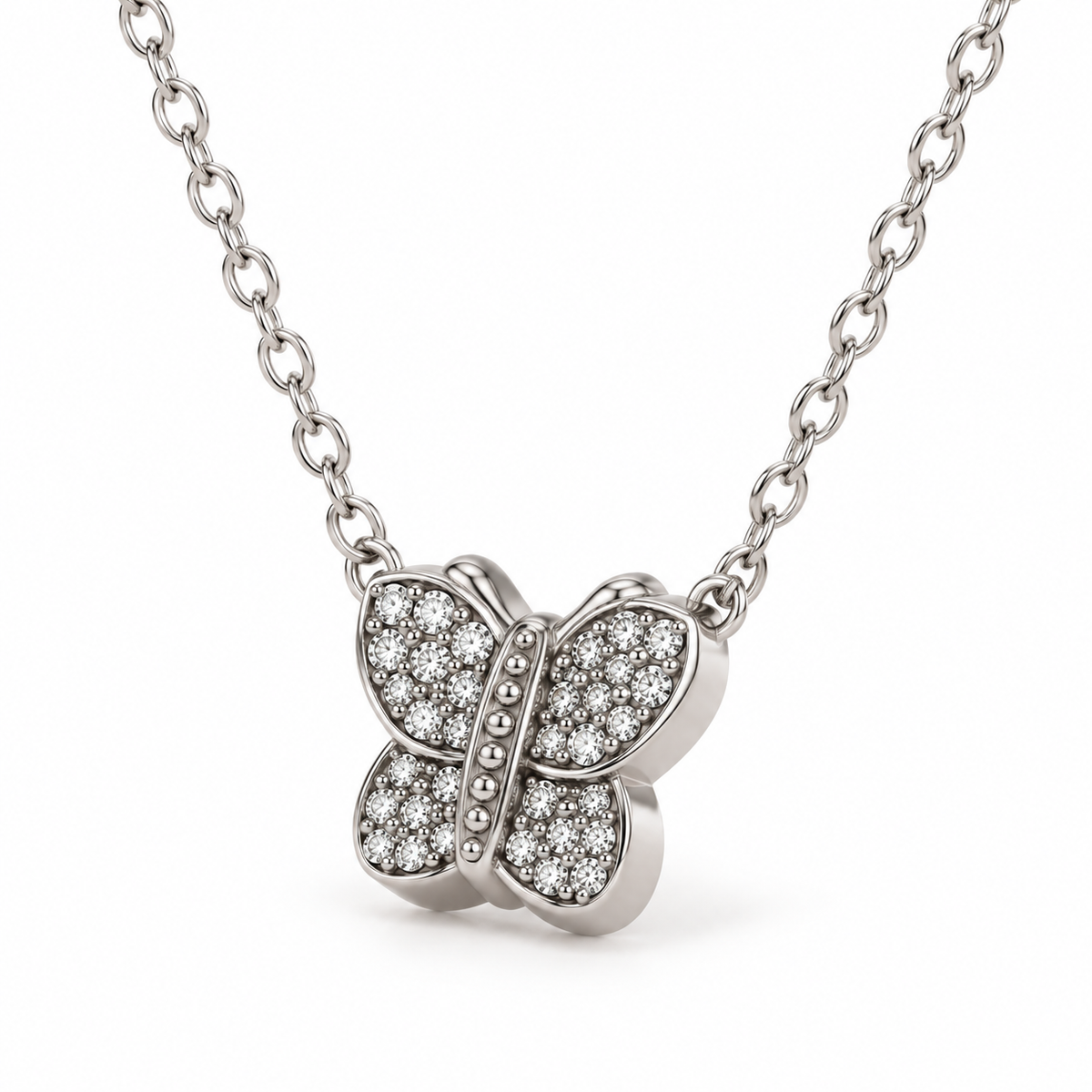 Close-up macro detail of 3D silver butterfly charm featuring brilliant pavé-set round cubic zirconia stones

