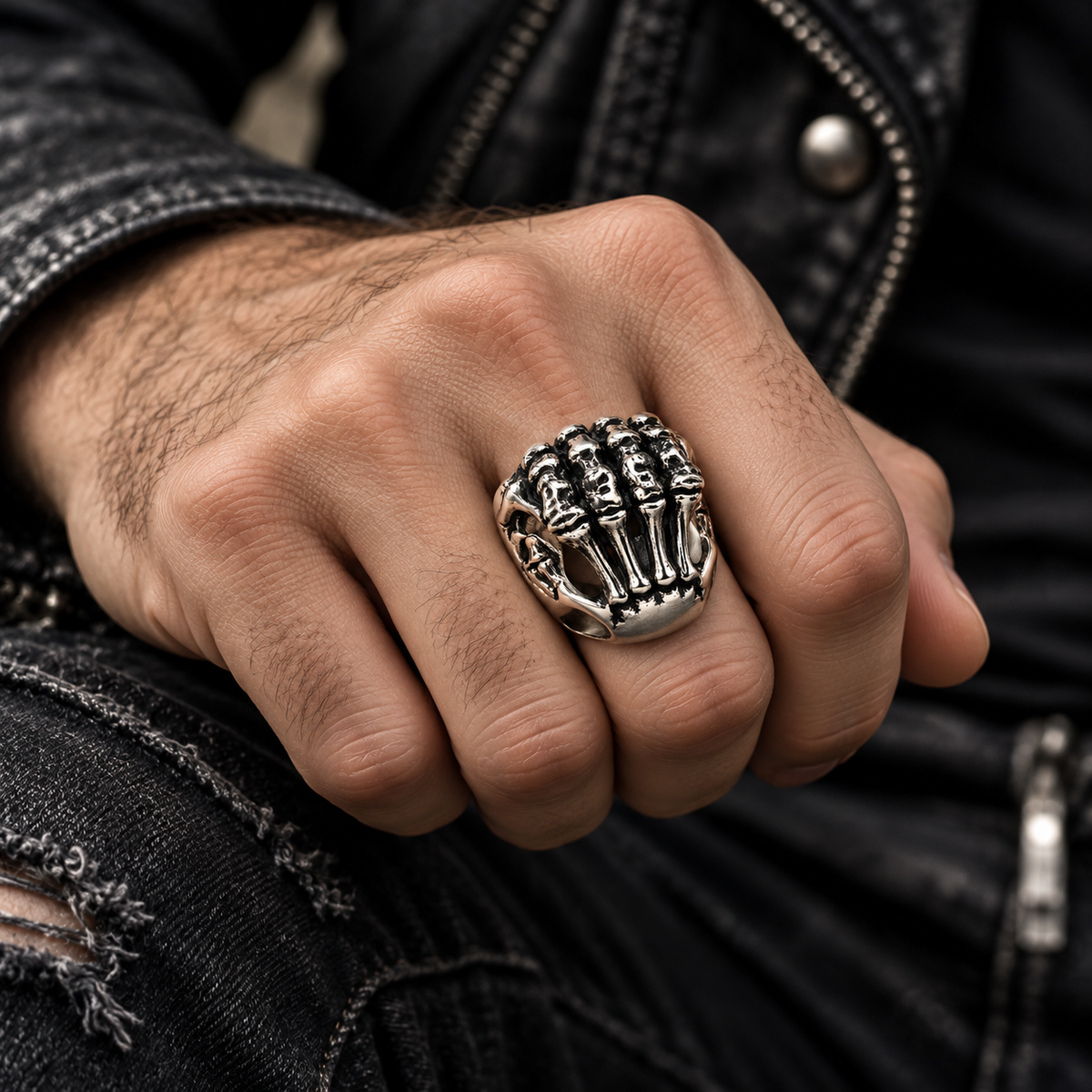 Close up of detailed finger bones and knuckle joints on skeleton ring
