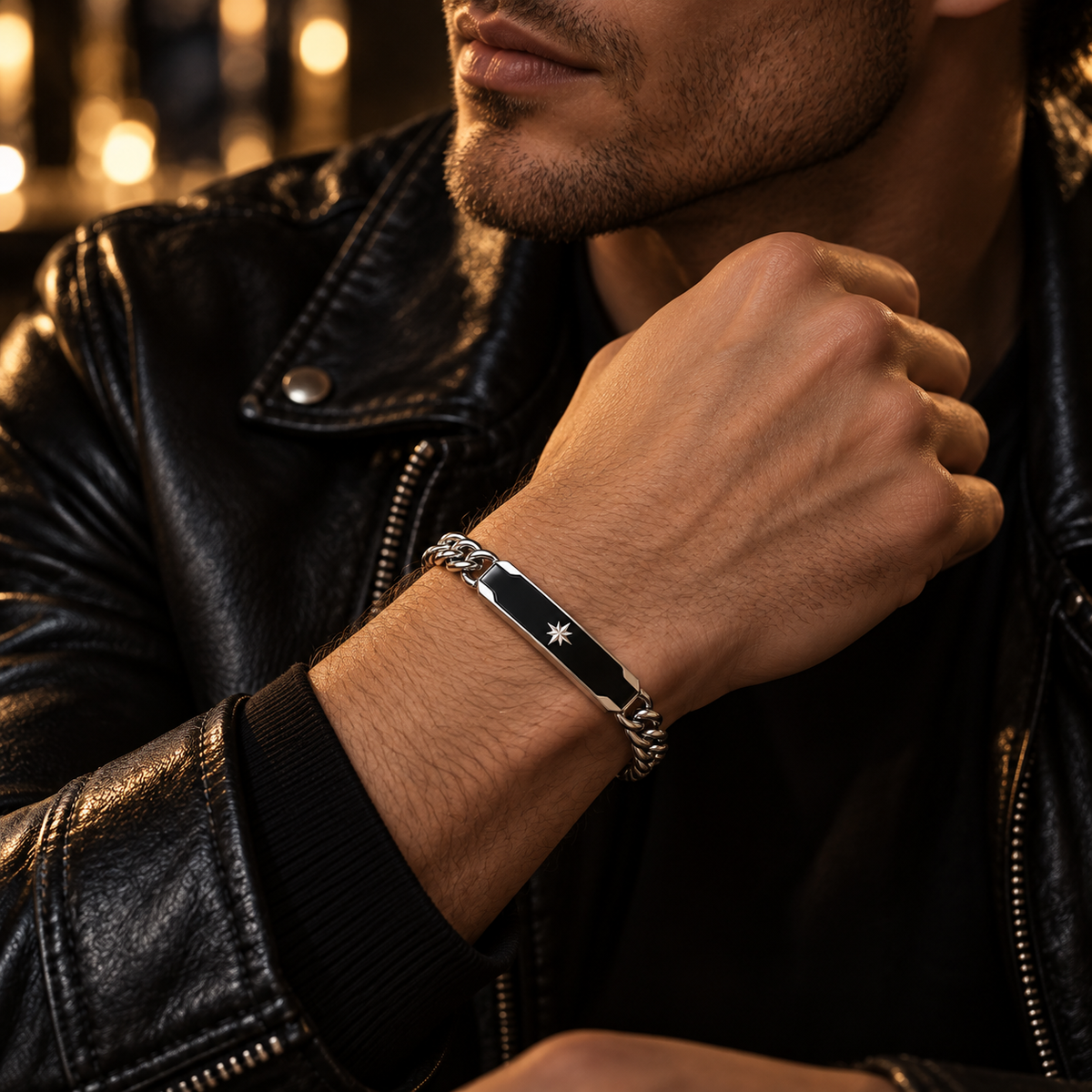 Model wearing men's steel black enamel North Star ID bracelet with black leather jacket
