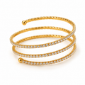 Women's 3-row spiral coil tennis wrap bangle bracelet featuring pavé cubic zirconia crystals in 18K gold plate with polished ball finials.
