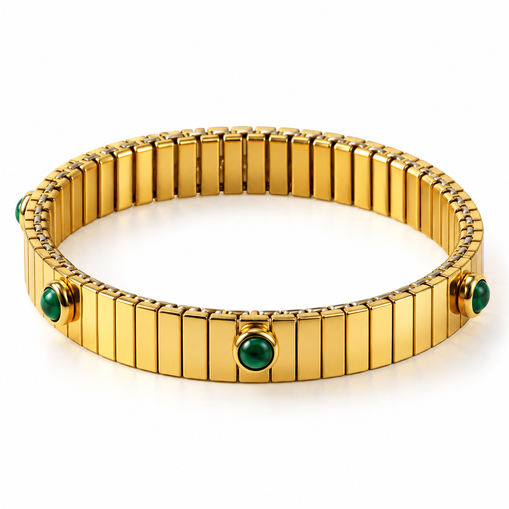 Women's vintage 18K gold ribbed stretch band bangle bracelet with green cabochon gemstones on white background
