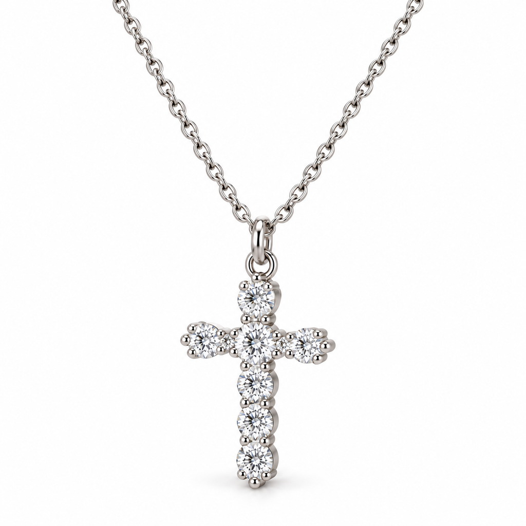 Women's sparkling clear CZ crystal cross pendant necklace in silver stainless steel close-up view

