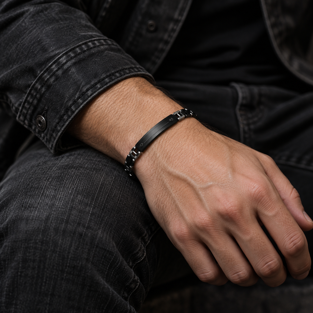 Model wearing men's stealth black link ID bracelet with black denim jacket
