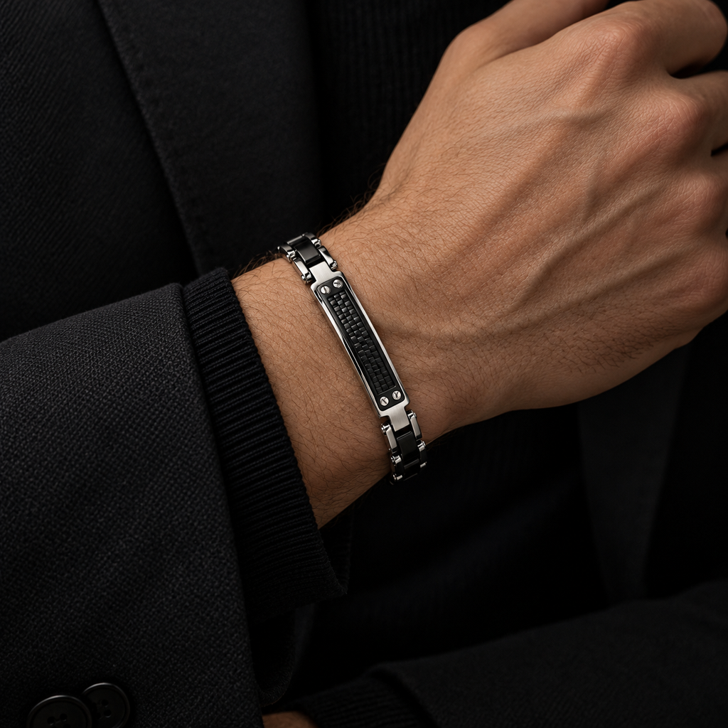 Model wearing men's two-tone motorcycle link carbon grid ID bracelet with black suit

