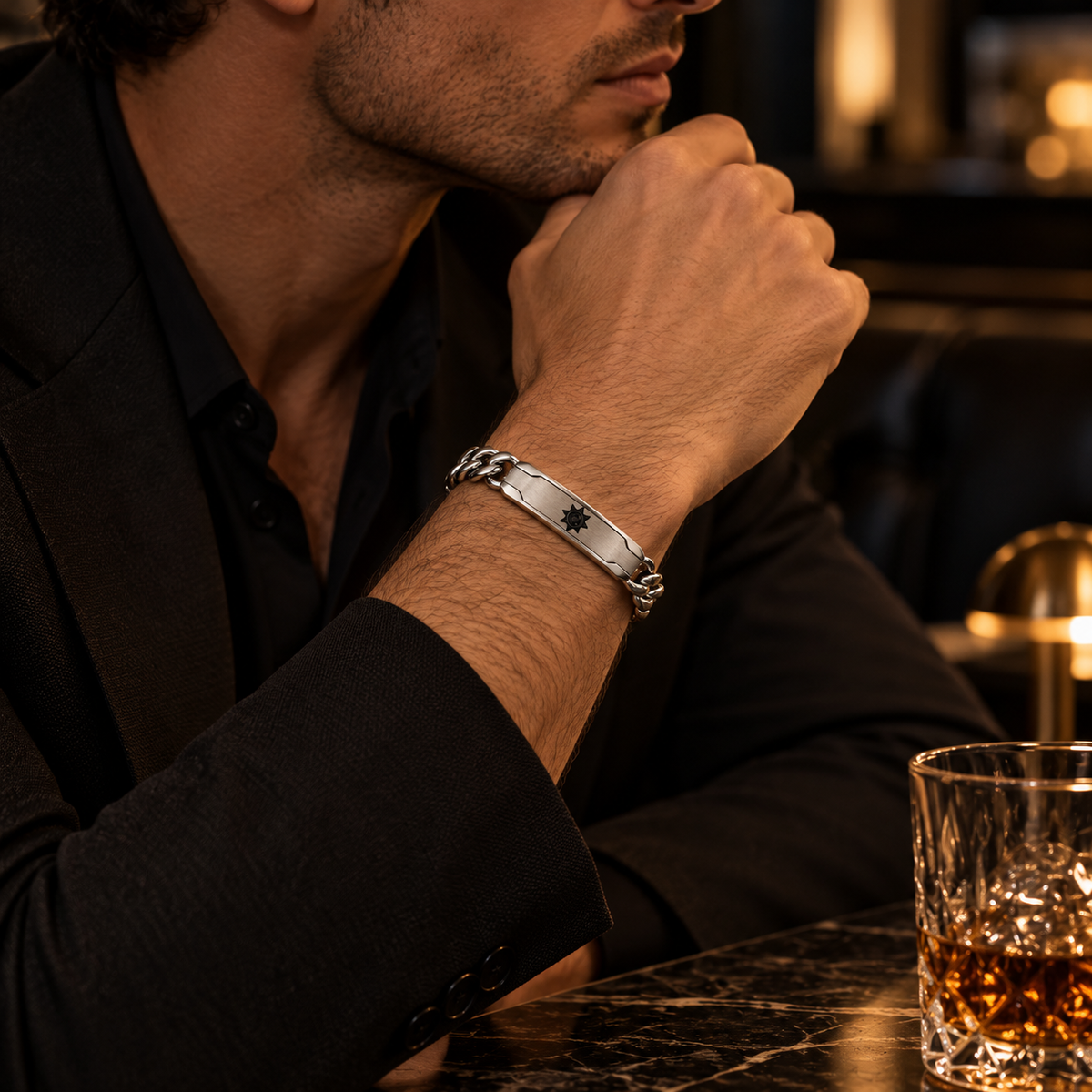 Model wearing men's stainless steel solar sun ID bracelet with formal black suit

