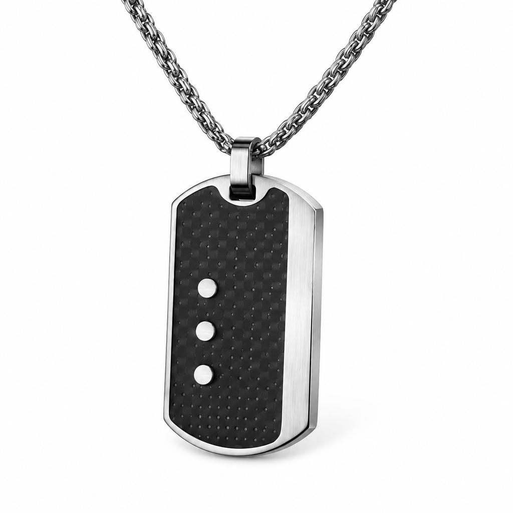 Angled studio close-up of men's perforated carbon fiber dog tag with triple steel rivets
