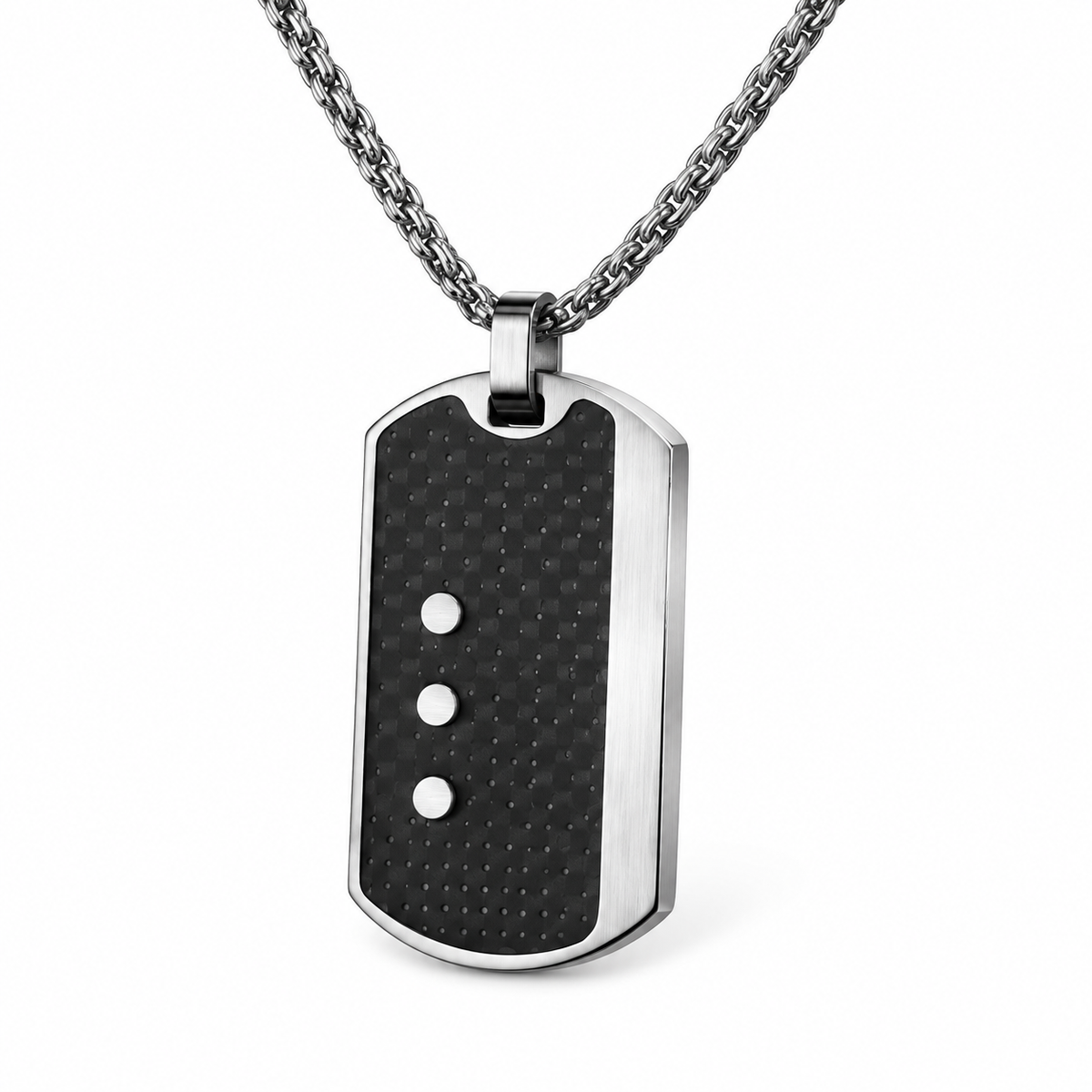 Angled studio close-up of men's perforated carbon fiber dog tag with triple steel rivets
