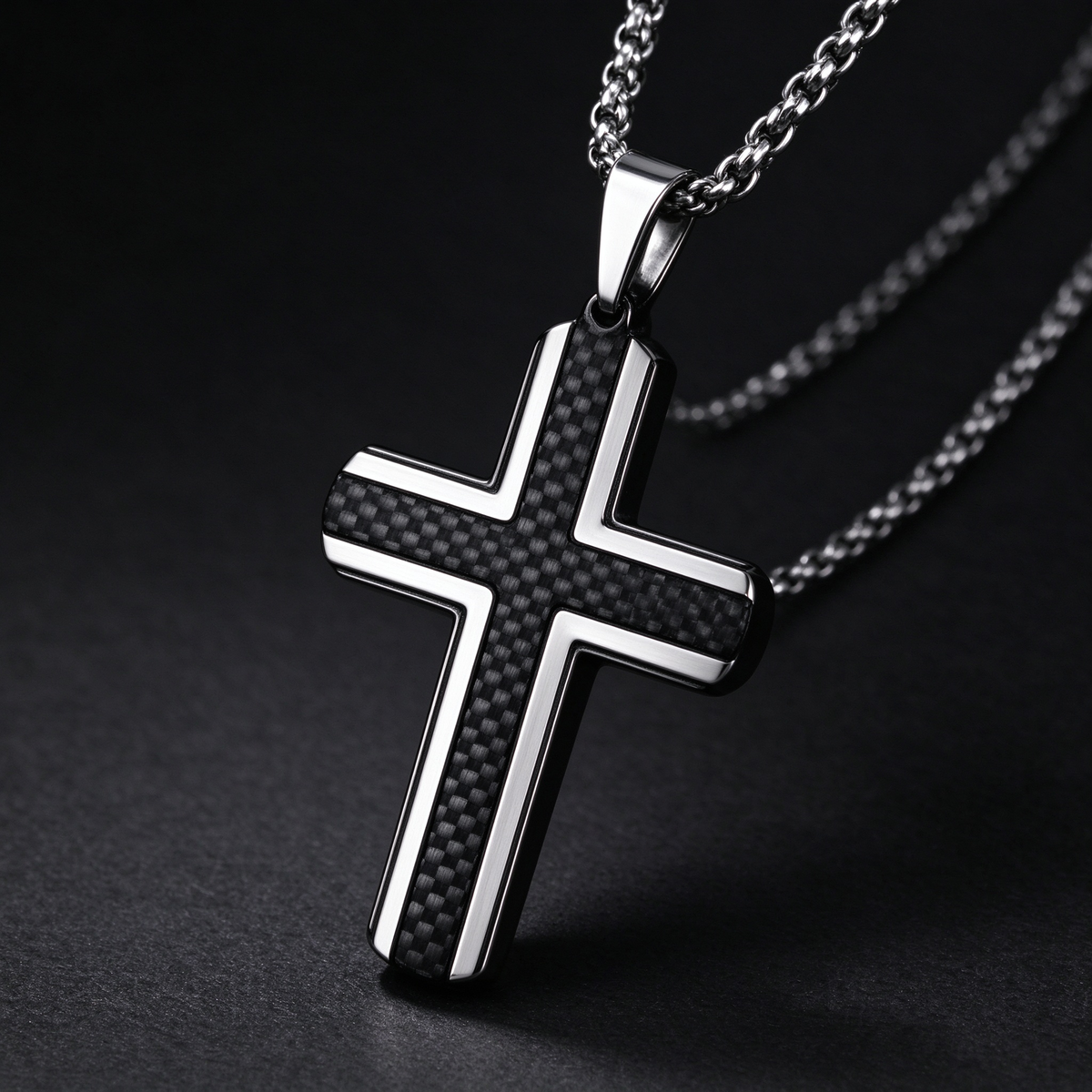 Angled studio close-up of men's black carbon fiber cross pendant on dark background
