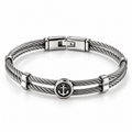Men's stainless steel twisted cable bangle bracelet with circular nautical anchor medallion
