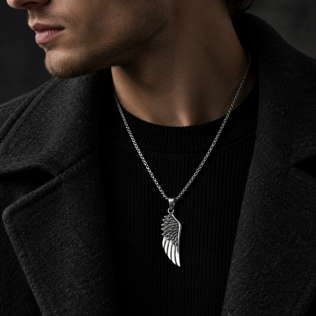 Model wearing men's stainless steel angel wing pendant necklace with black wool coat
