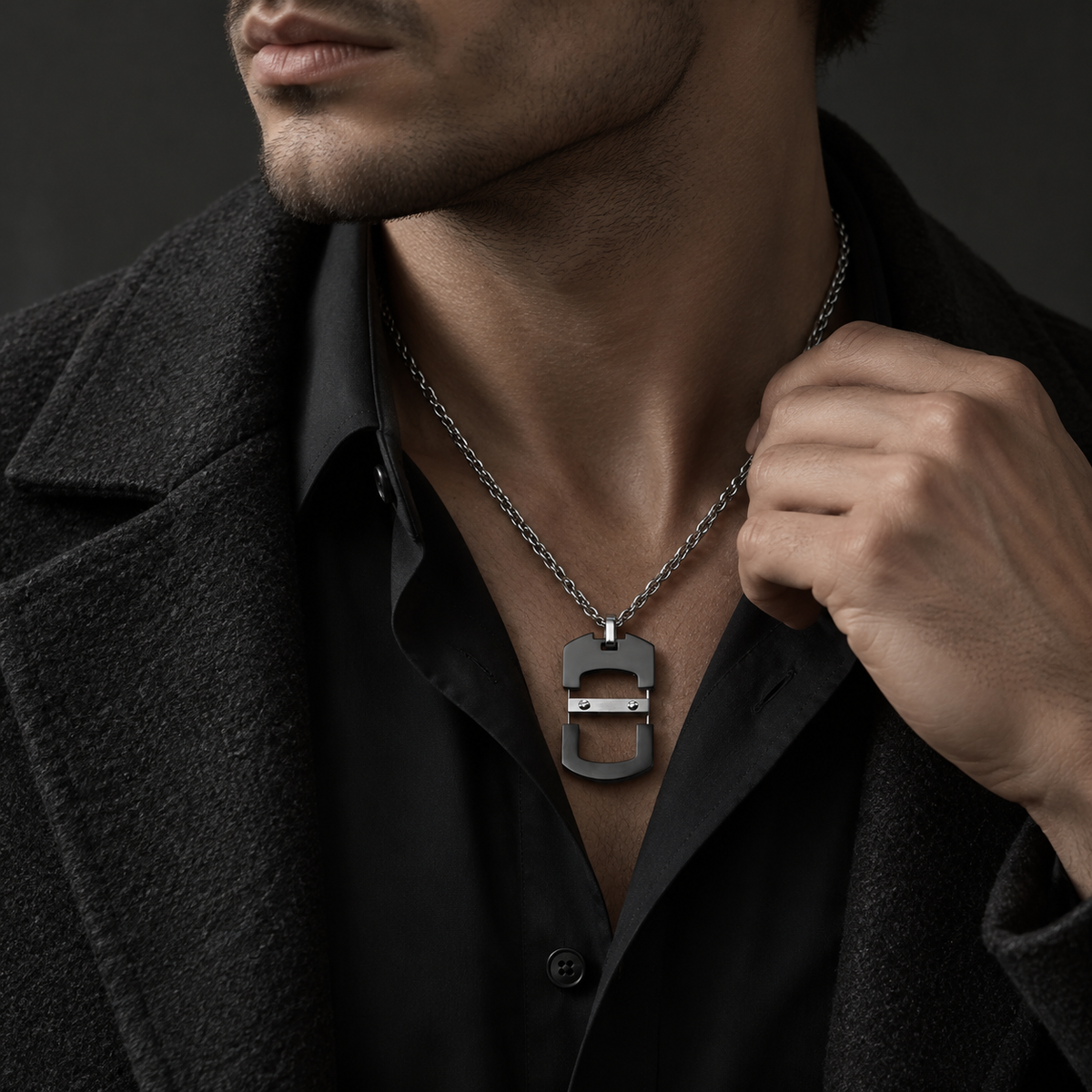 Model wearing men's open-work industrial dog tag pendant with black coat and dress shirt
