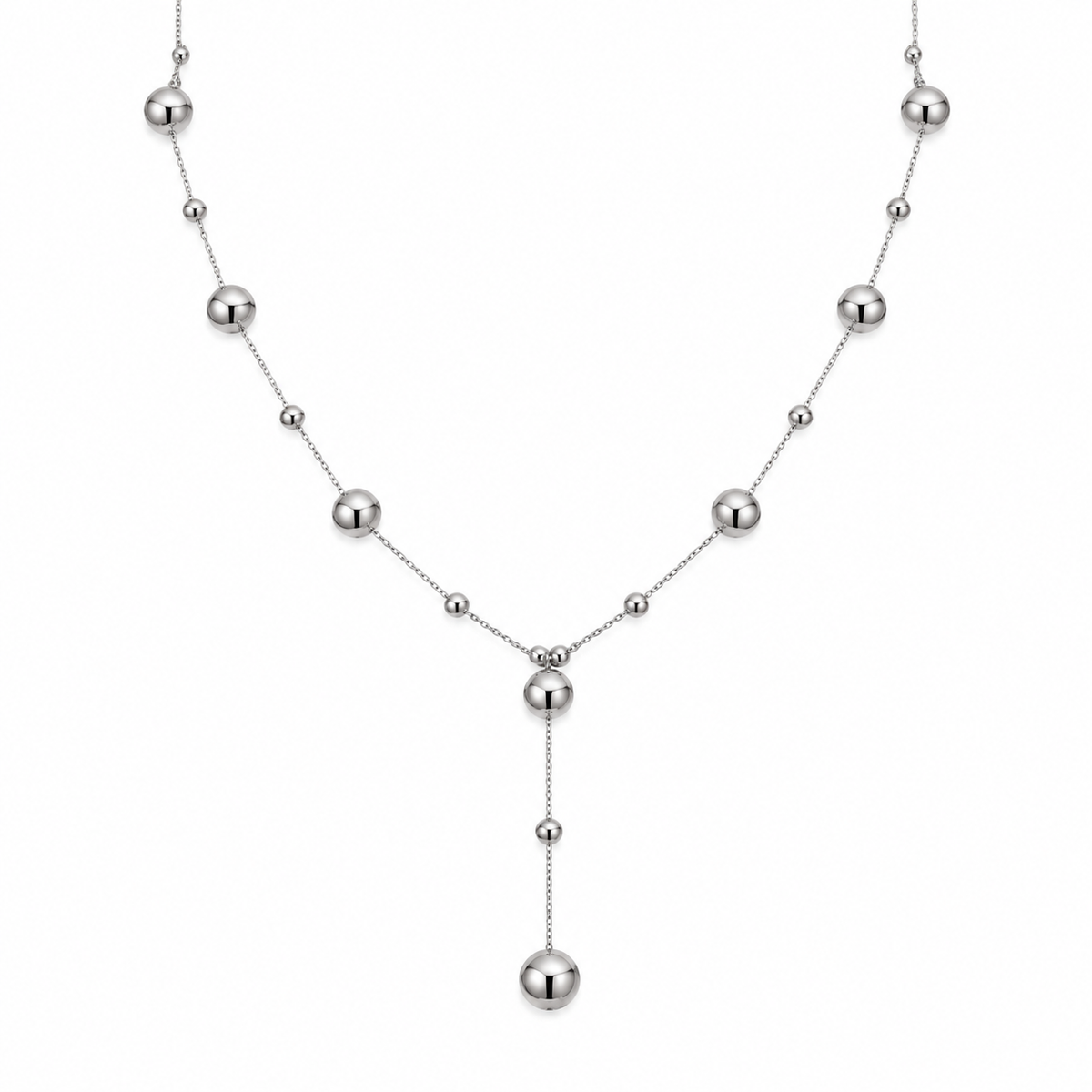 Women's polished stainless steel station ball bead lariat Y-necklace on white background

