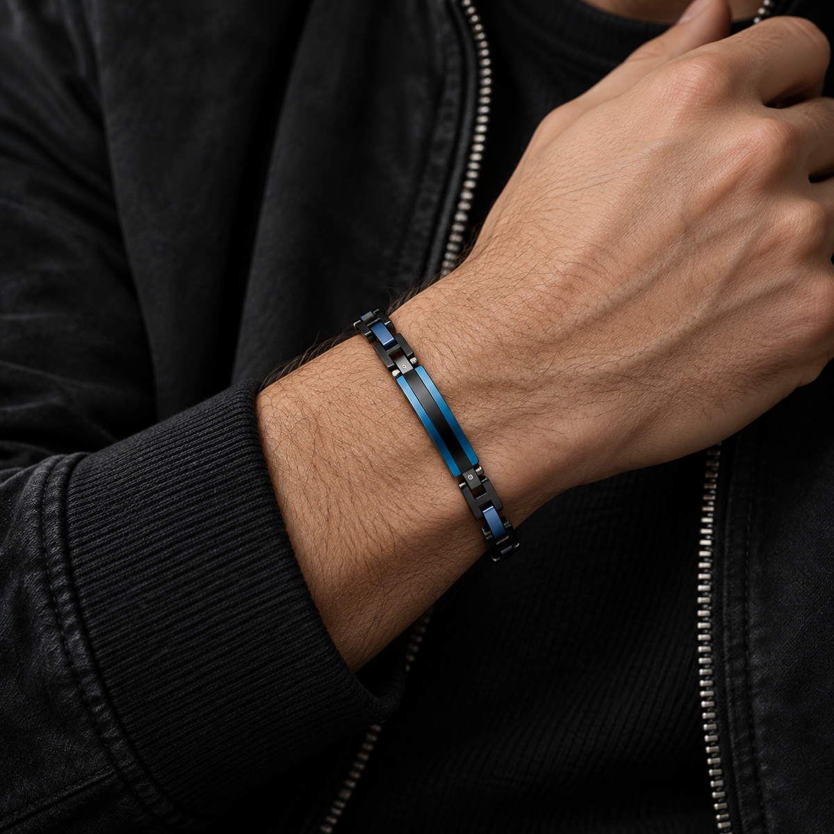 Close-up wrist view of men's mechanical black and blue stainless steel bracelet
