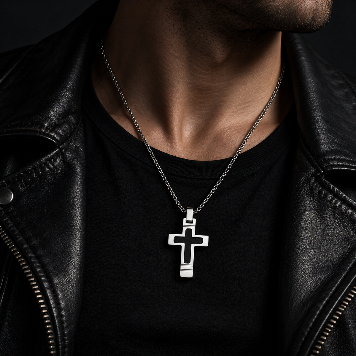 Model wearing men's silver and black inlay cross necklace with black leather jacket
