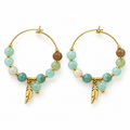 Pair of women's boho gold hoop earrings with multi-tone green natural stone beads and dangling feather charms on white background
