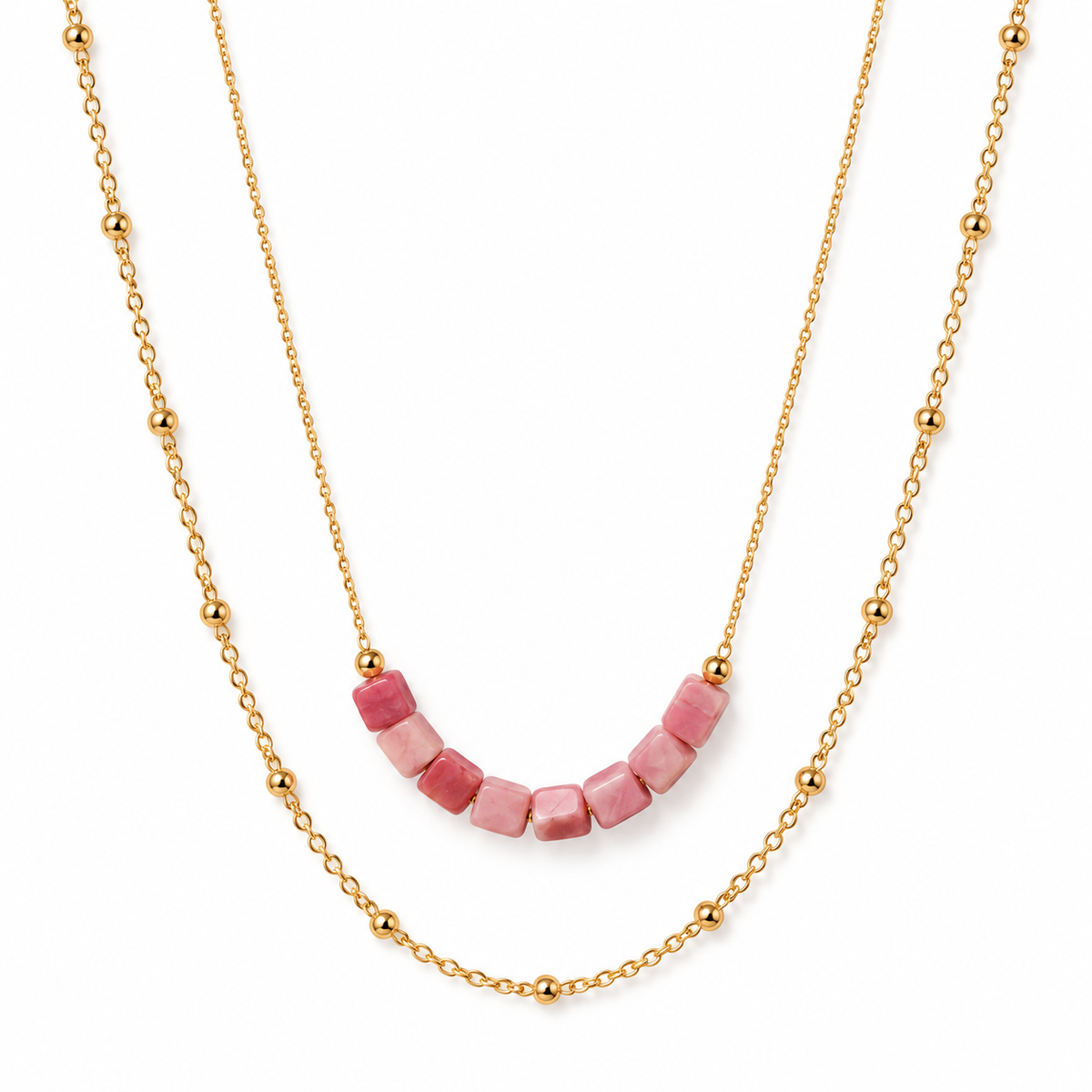 Women's layered gold necklace featuring natural pink rhodonite cube beads and a dainty beaded satellite chain.
