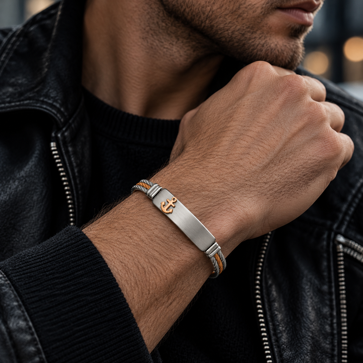 Model wearing men's two-tone cable gold anchor bracelet with black leather jacket
