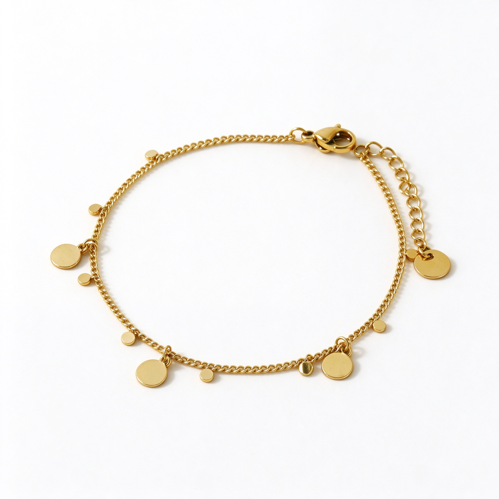 Women's 18K gold plated stainless steel chain bracelet with hanging polished disc charms on white background
