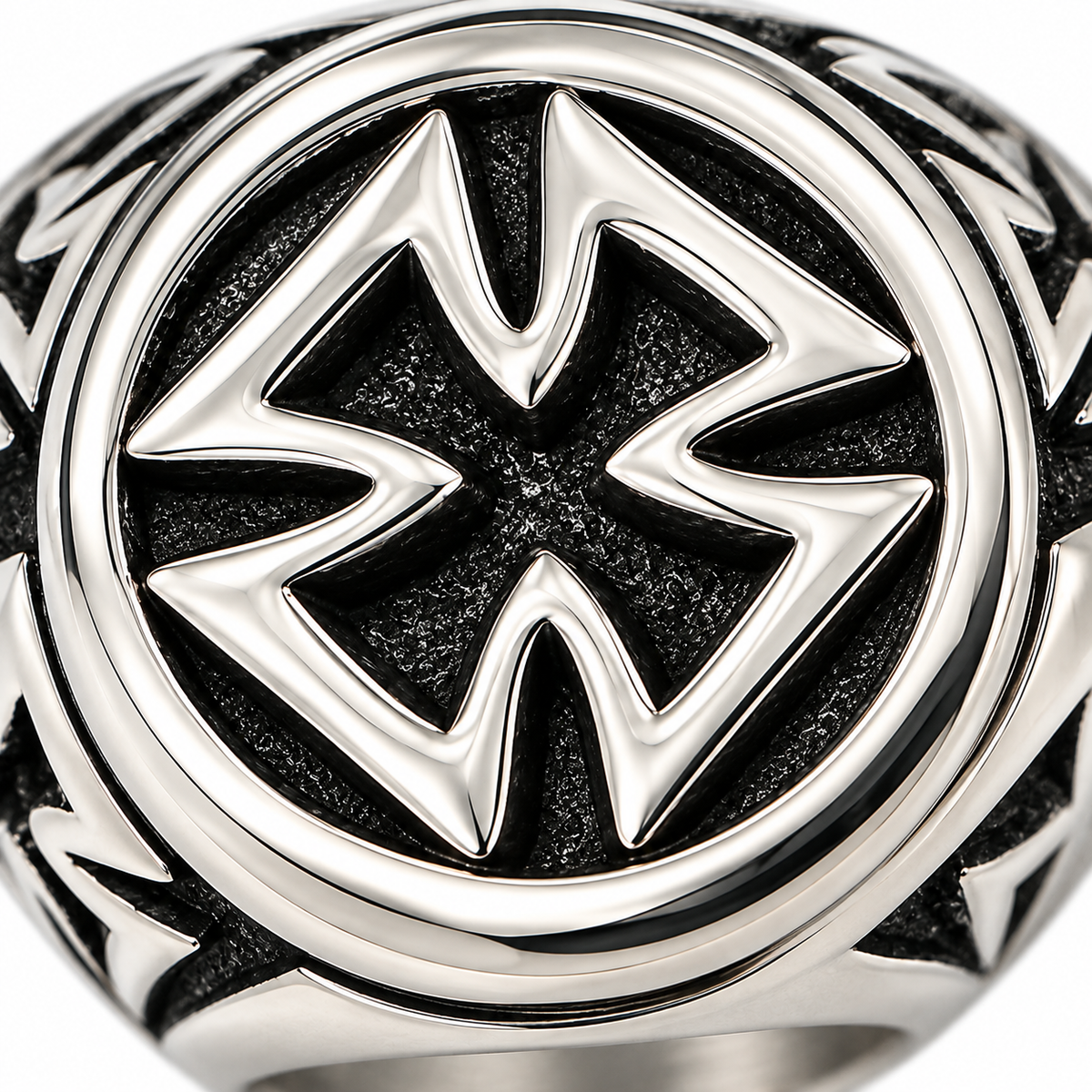 Close-up macro detail of the sculpted Iron Cross signet face on stainless steel ring