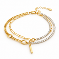Women's layered gold bracelet featuring spliced paperclip and curb chains with cubic zirconia tennis strands and a dangling bar pendant.
