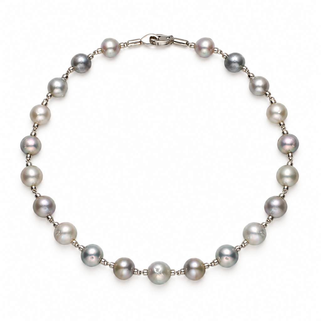 Overhead studio view of circular grey freshwater pearl strand bracelet with stainless steel hardware
