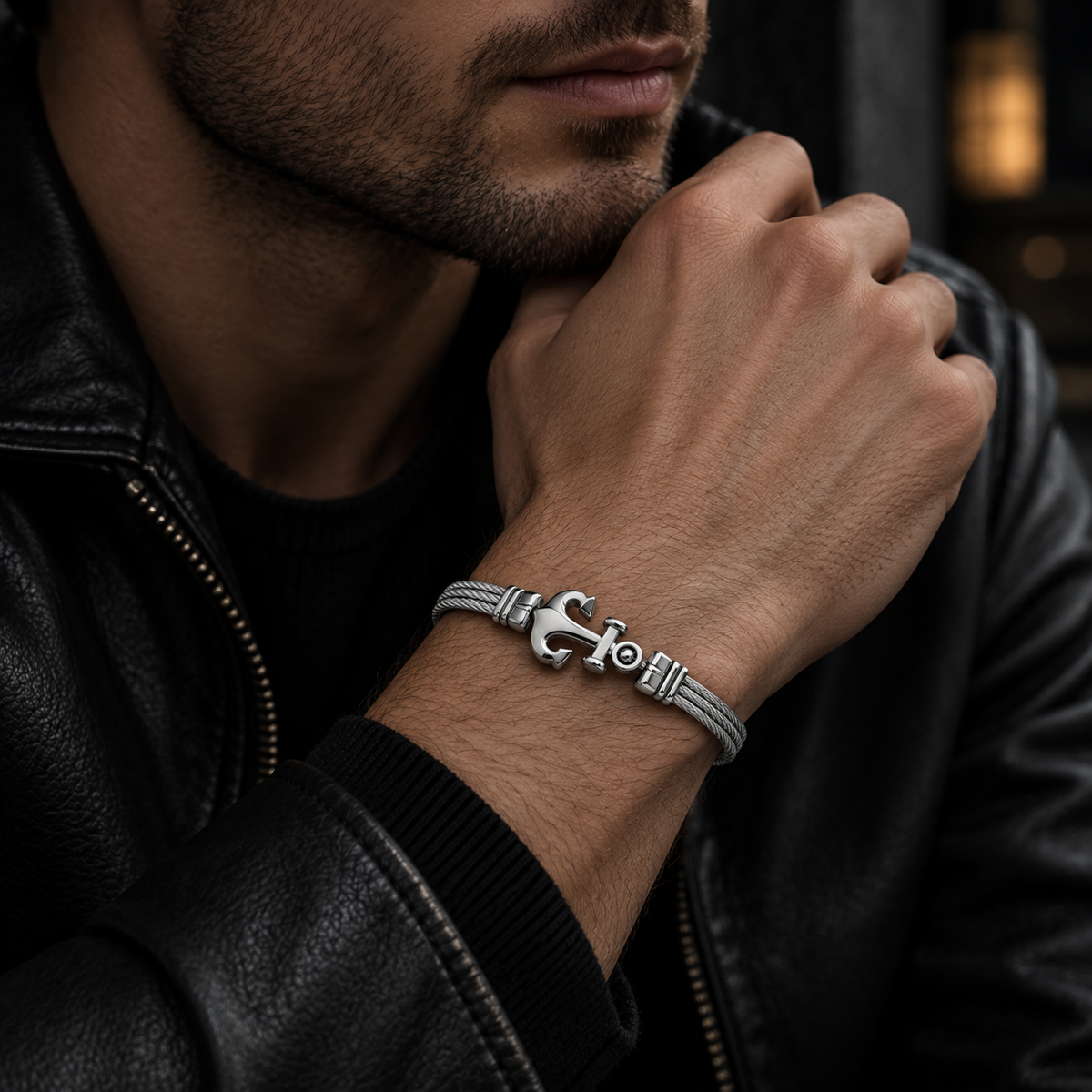 Model wearing men's steel cable sculpted anchor bracelet with black leather jacket
