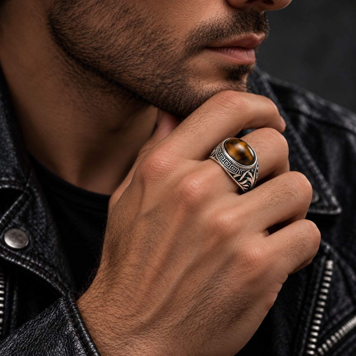 Model wearing vintage men's tiger eye signet ring on finger
