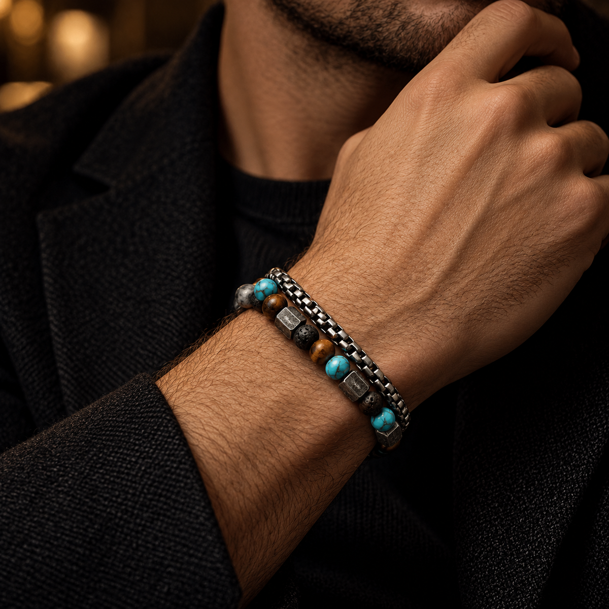 Close-up wrist shot of men's double-strand turquoise stone and industrial steel box chain bracelet