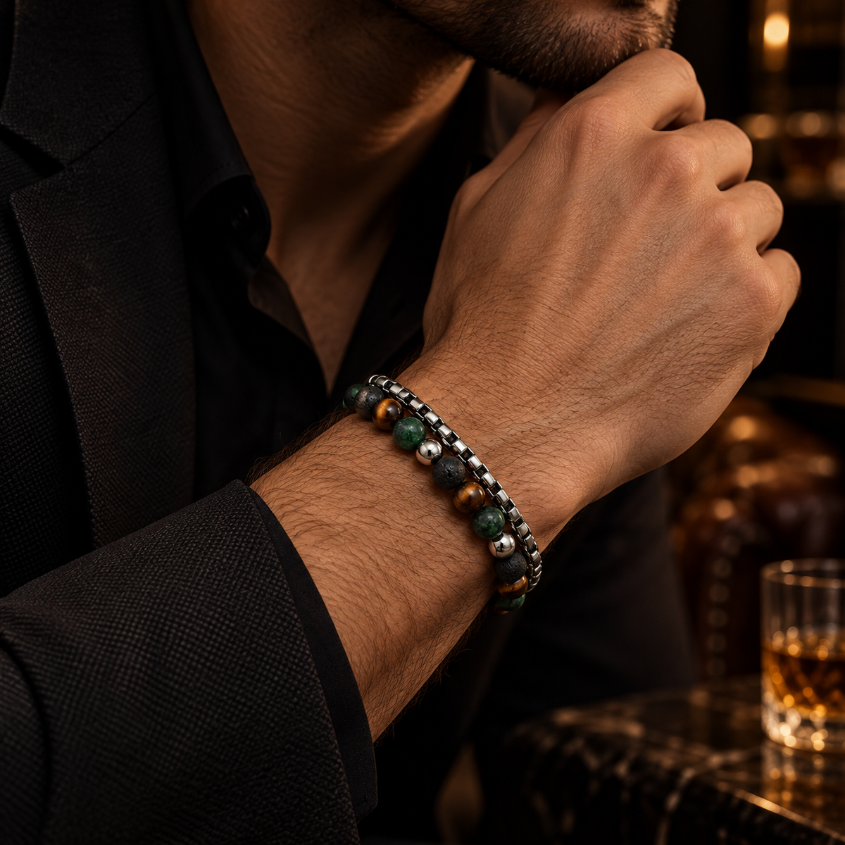 Close-up of male wrist wearing Men's lava stone and green jasper chain bracelet
