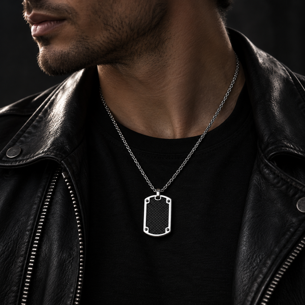 Model wearing men's industrial four-rivet dog tag necklace on black crewneck shirt
