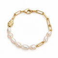 Baroque freshwater pearl and 18K gold plated paperclip chain bracelet with molten gold accents on white background
