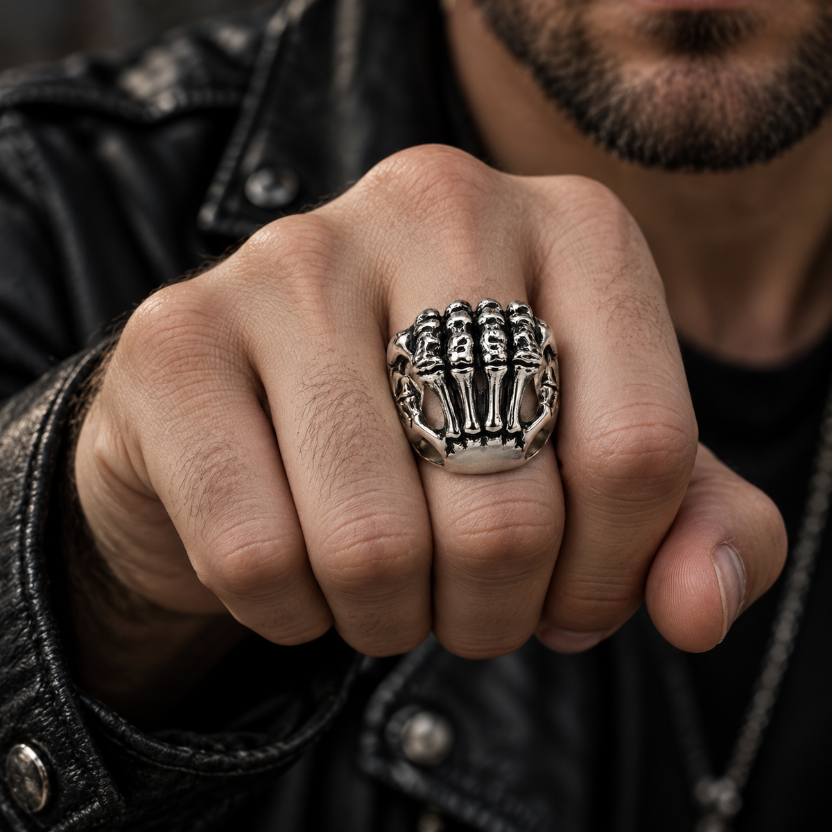 Model wearing vintage stainless steel skeleton claw ring on hand
