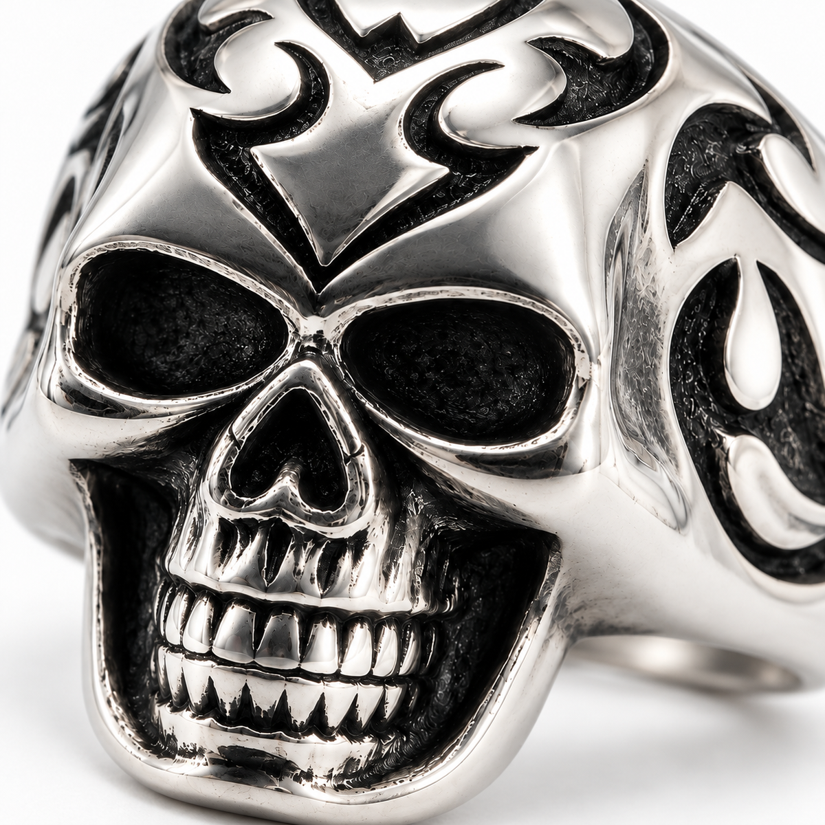 Close up of deep tribal flame engravings on skull forehead

