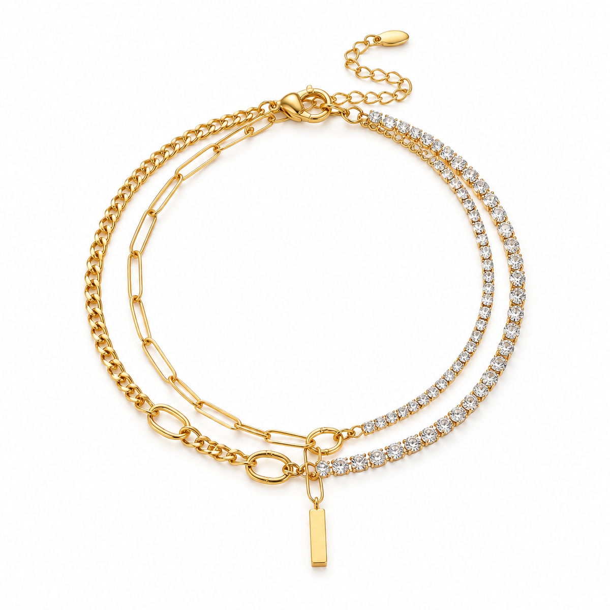 Full product flat lay of the double-layer asymmetric gold paperclip chain and CZ tennis bracelet with lobster claw clasp and extender.
